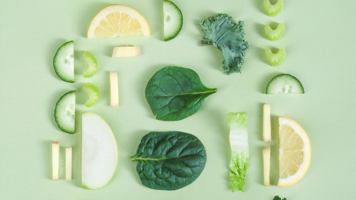 Fresh ginger, cucumber, lemon, and leafy greens for digestive health